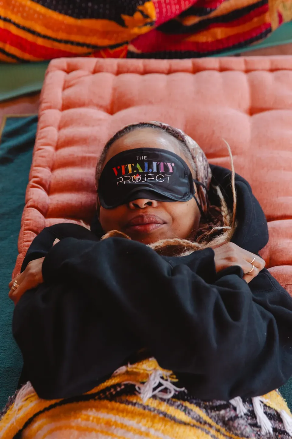 A member resting with a Vitality eye mask