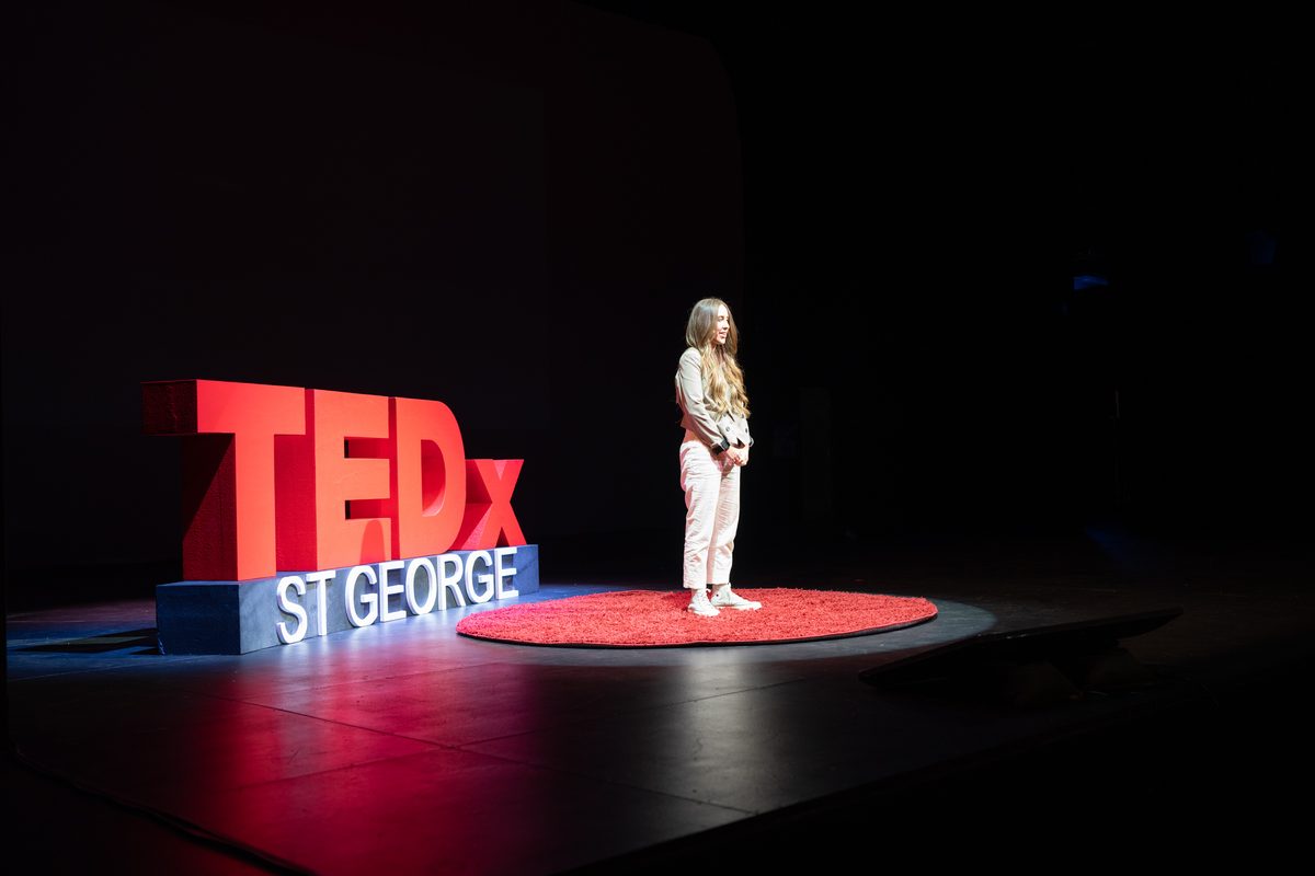 Elizabeth Faye speaking at a corporate event