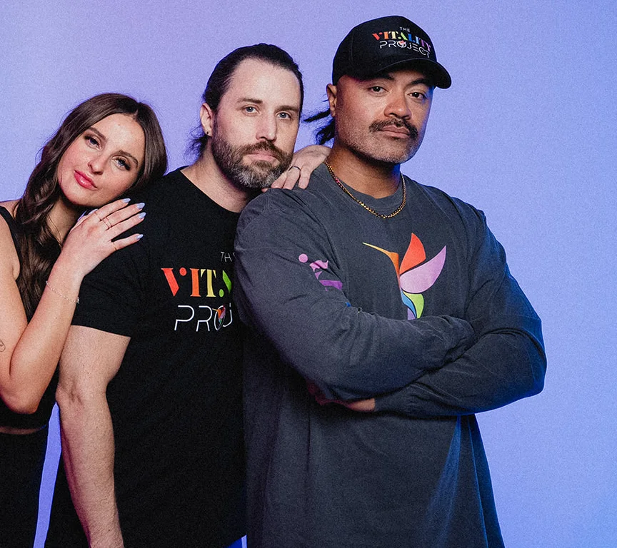 Three members of a salon team together in Vitality Project shirts
